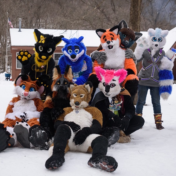 fursuiters pose outside in the snow at Whitewater State Park